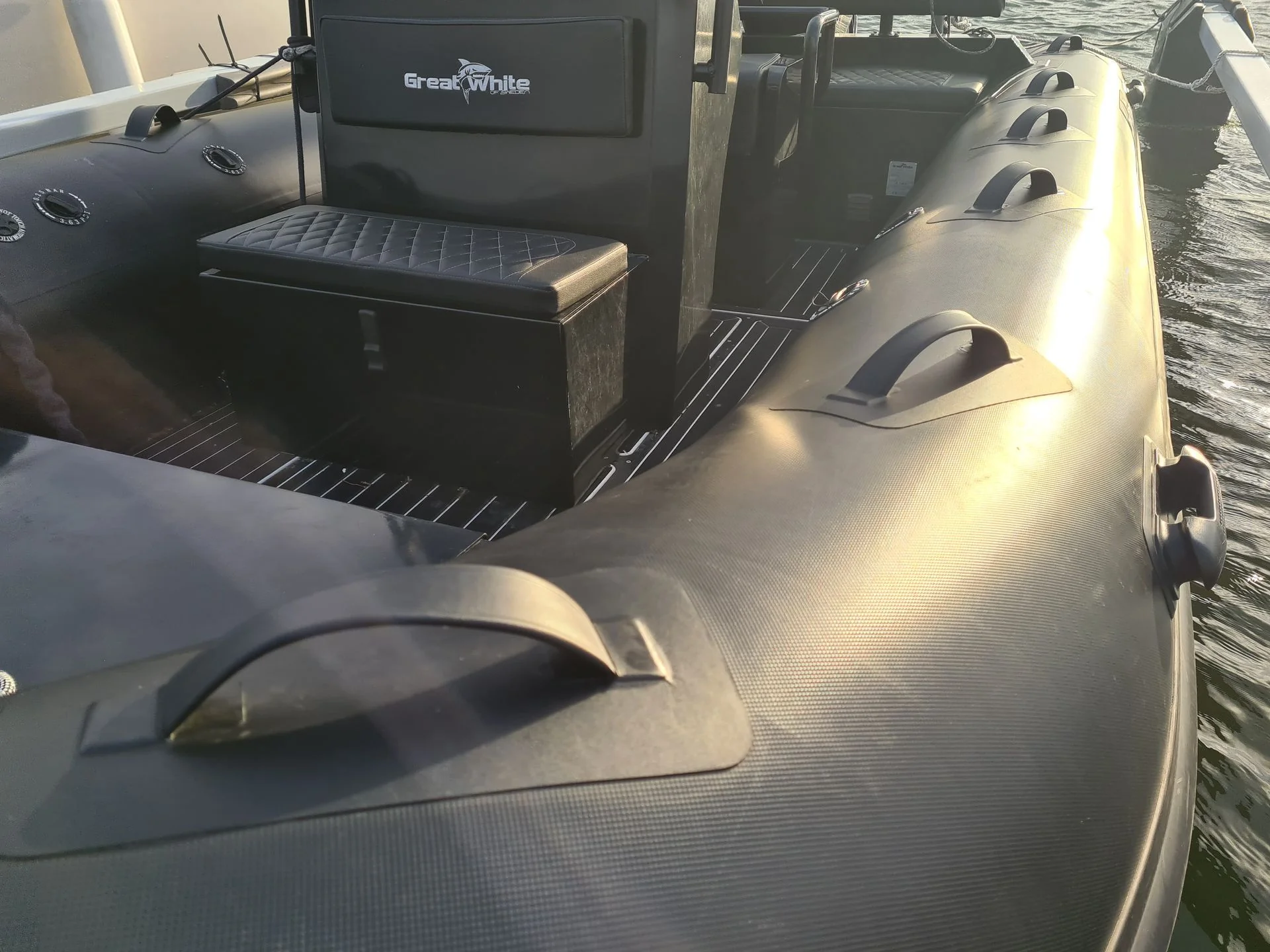 Inflatable boat interior with console and seating at Cape Coral dock, morning light.