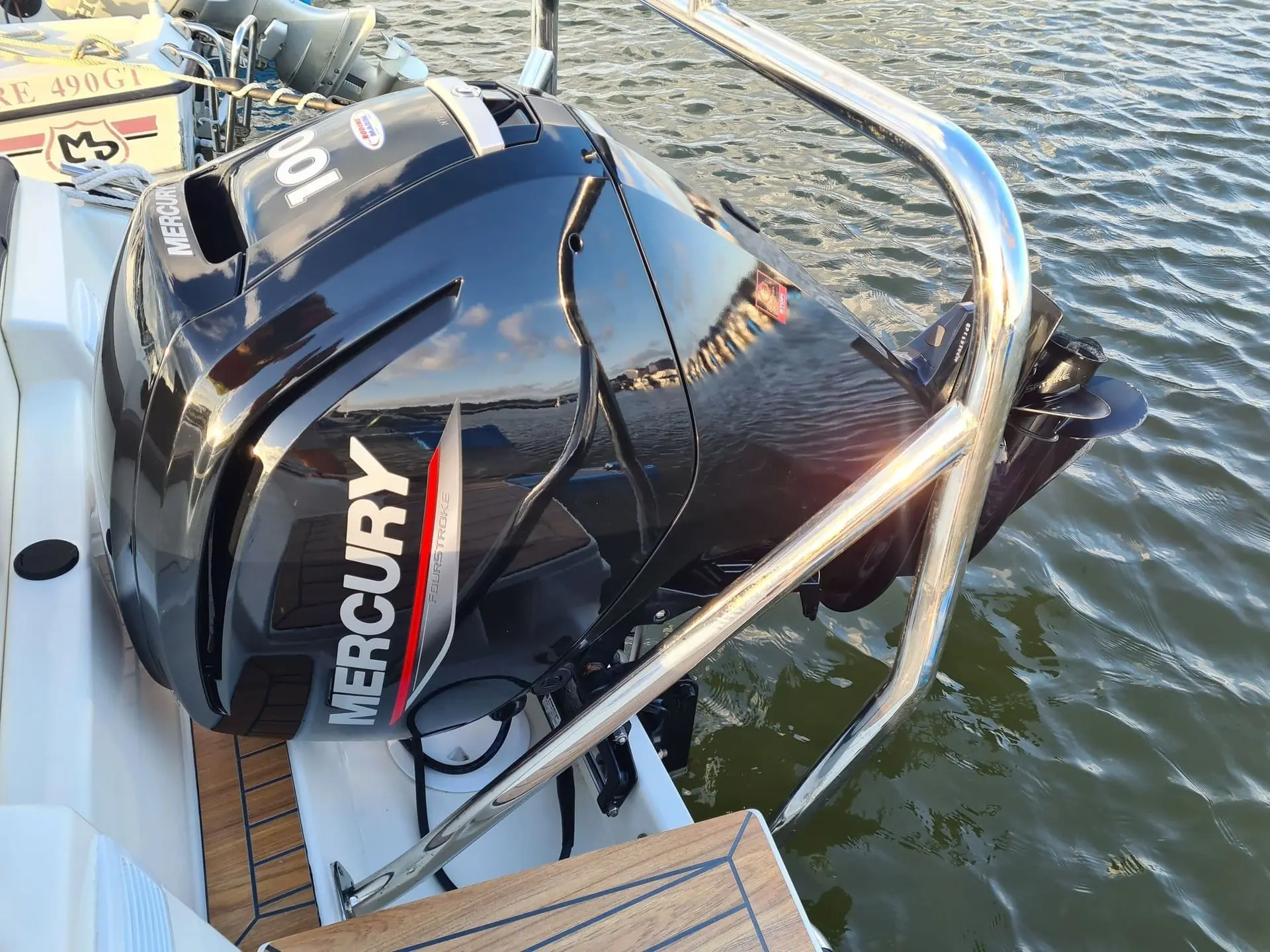 Outboard motor mounted on recreational powerboat transom in Cape Coral canal waters.