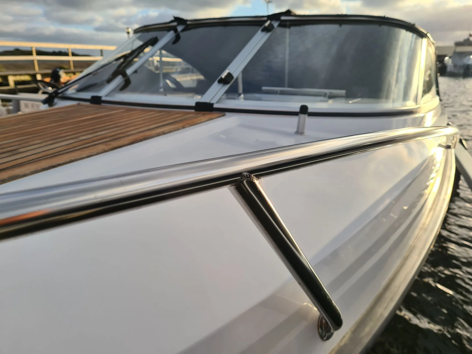 Boat windshield and canvas top detail on docked recreational powerboat in Cape Coral.
